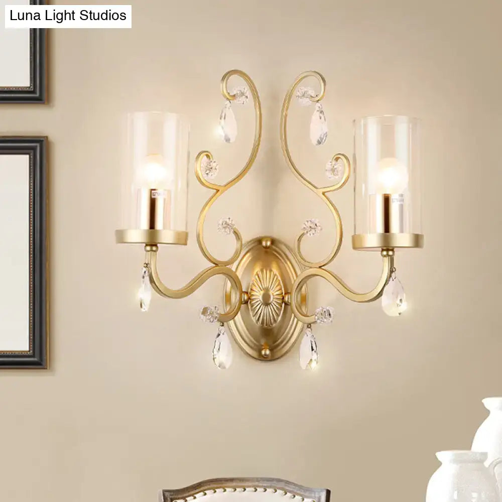Gold Cylinder Wall Light two-light brass sconce with glass cylinder shades and crystal drops on Tampa Home & Garden Store