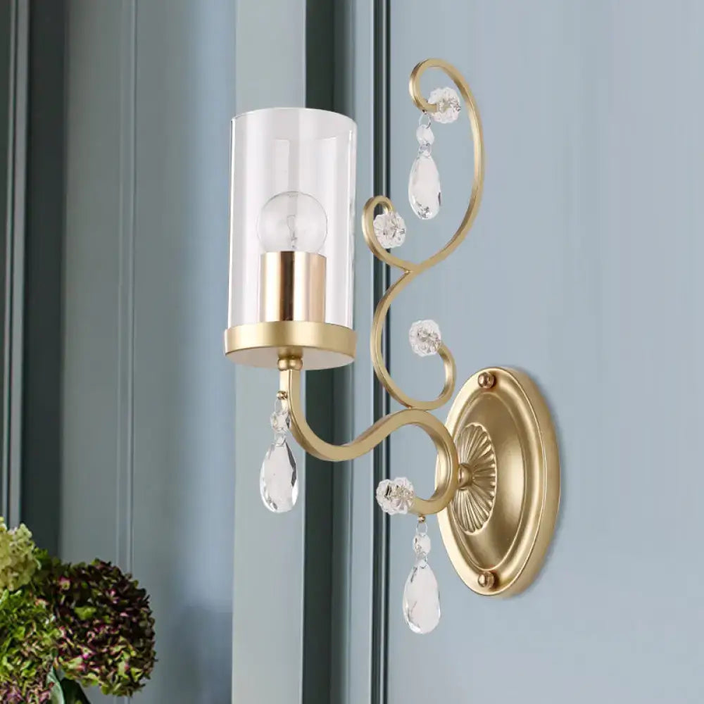 Gold cylinder wall light by Decorbites with glass shade and crystal drops on brass mount on Tampa Home & Garden Store