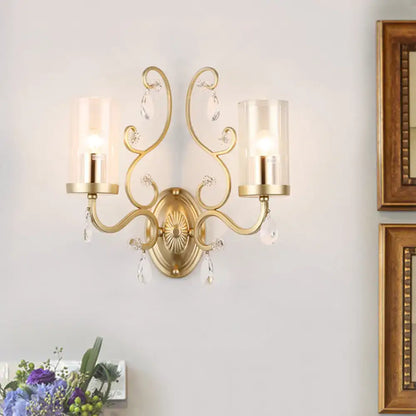 Gold Cylinder Wall Light by Decorbites, gold finish dual-arm sconce with crystal drops on Tampa Home & Garden Store