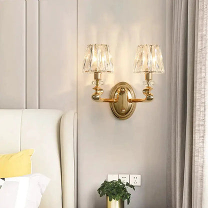 Modern gold crystal wall light fixture with dual brass arms and glass shades by Decorbites on Tampa Home & Garden Store
