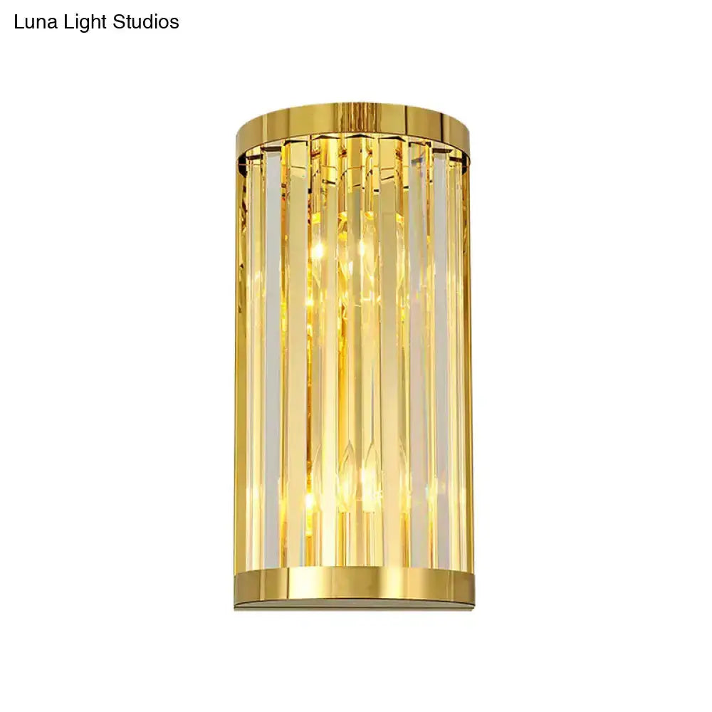 Modern gold crystal wall sconce with vertical prisms and warm lighting by Decorbites on Tampa Home & Garden Store