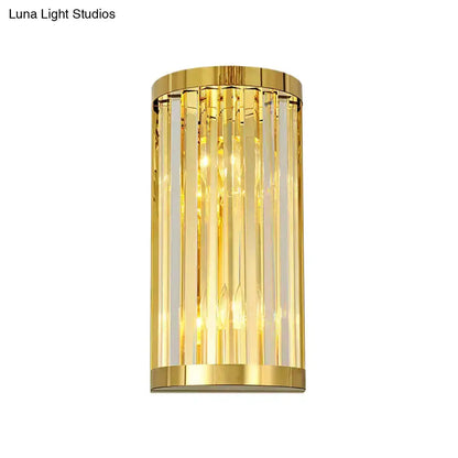 Modern gold crystal wall sconce with vertical prisms and warm lighting by Decorbites on Tampa Home & Garden Store
