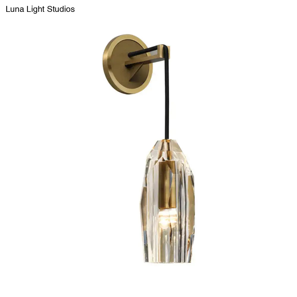 Gold crystal wired sconce with brass circular backplate and faceted glass shade on Tampa Home & Garden Store