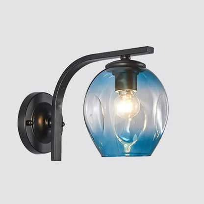 Modern glass wall sconce with curved black arm and blue shade by Decorbites on Tampa Home & Garden Store