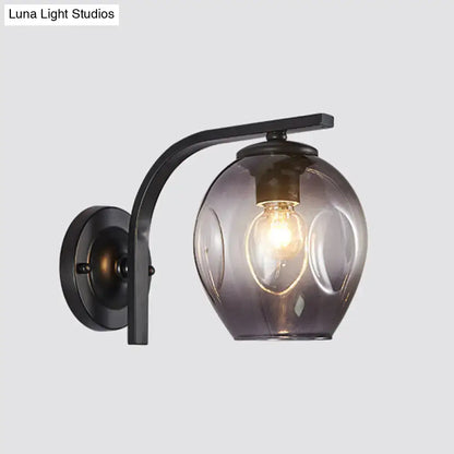 Black curved-arm glass wall sconce with smoky shade, Decorbites lamp Tampa Home & Garden Store on Tampa Home & Garden Store