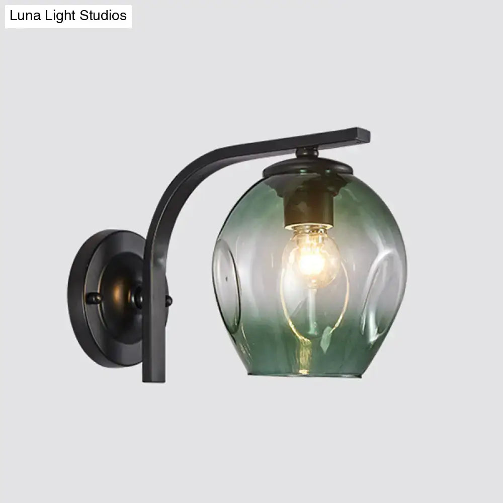 Decorbites curved-arm glass wall sconce with black finish and green shade on Tampa Home & Garden Store