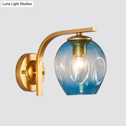 Modern gold curved arm glass wall sconce by Decorbites with blue gradient shade on Tampa Home & Garden Store