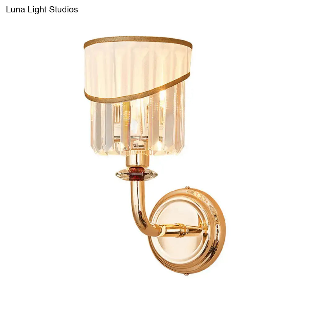 Gold crystal arm sconce with curved gold arm and crystal prism shade on Tampa Home & Garden Store