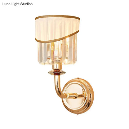 Gold crystal arm sconce with curved gold arm and crystal prism shade on Tampa Home & Garden Store