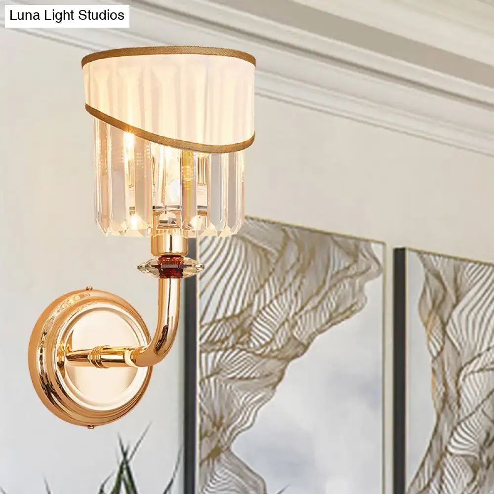 Gold crystal arm sconce with white fabric shade and hanging prisms by Decorbites on Tampa Home & Garden Store