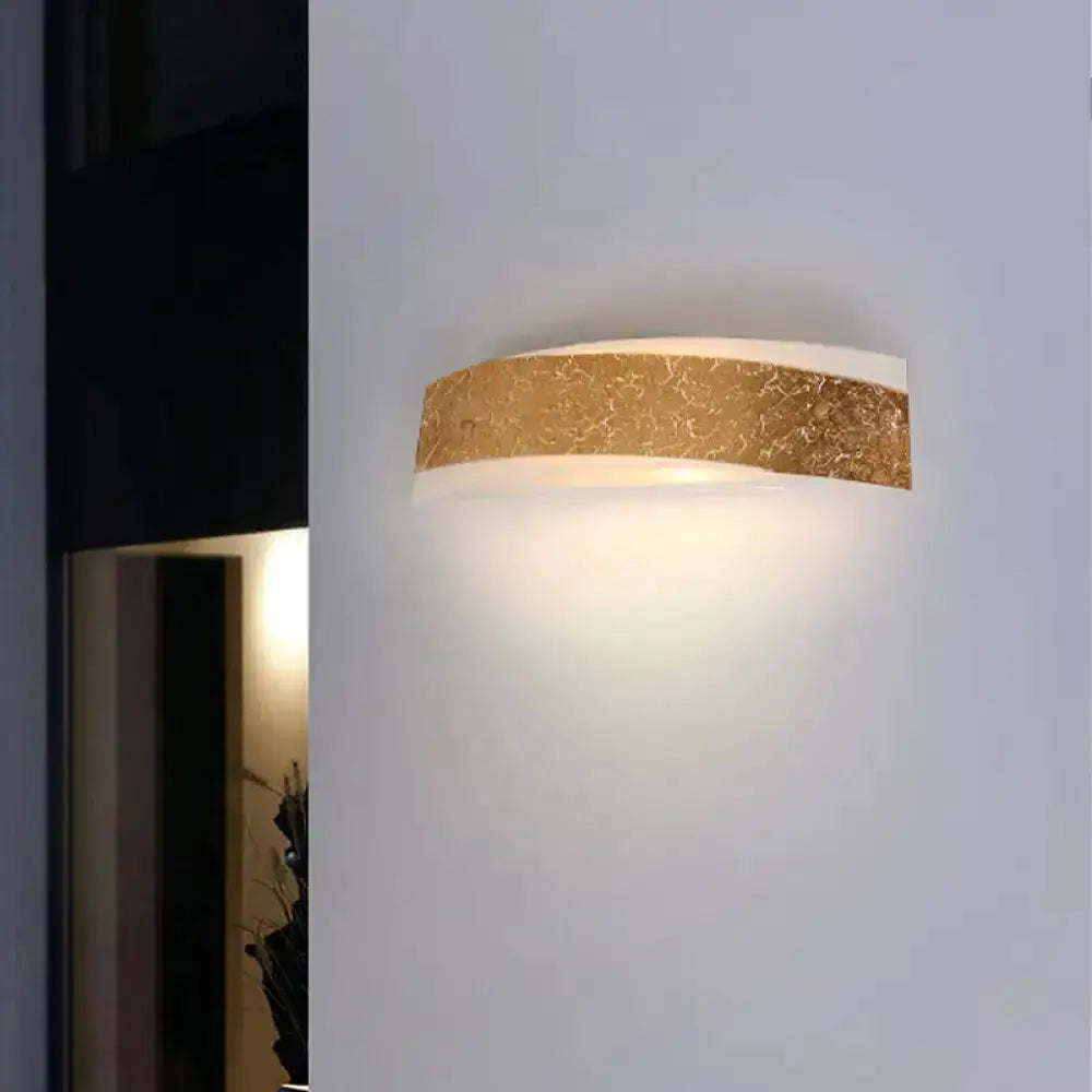 Modern gold curved LED wall lamp for living room, wall-mounted with textured gold band on Tampa Home & Garden Store