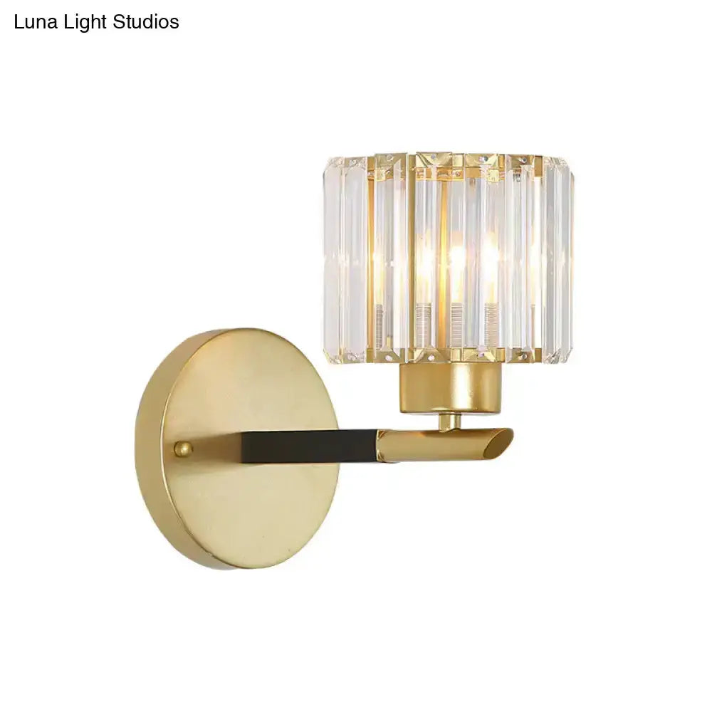 Modern gold cylinder crystal wall sconce by Decorbites with round backplate and crystal shade on Tampa Home & Garden Store