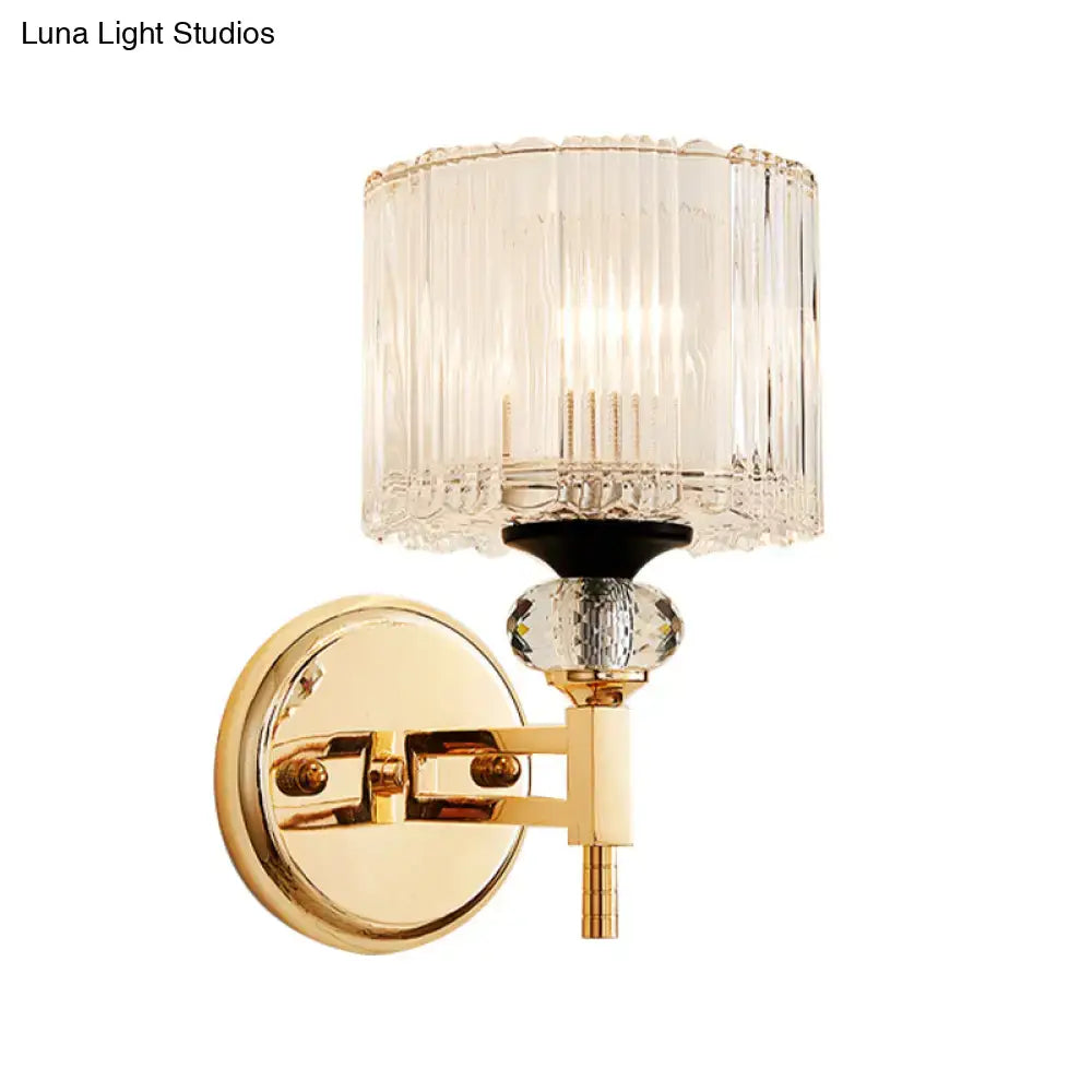 Gold crystal wall sconce with cylindrical glass shade and brass finish by Decorbites on Tampa Home & Garden Store