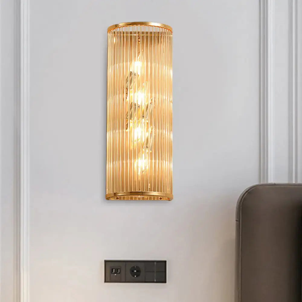 Gold crystal cylinder wall lamp by Decorbites, gold metal frame with vertical glass rods on Tampa Home & Garden Store