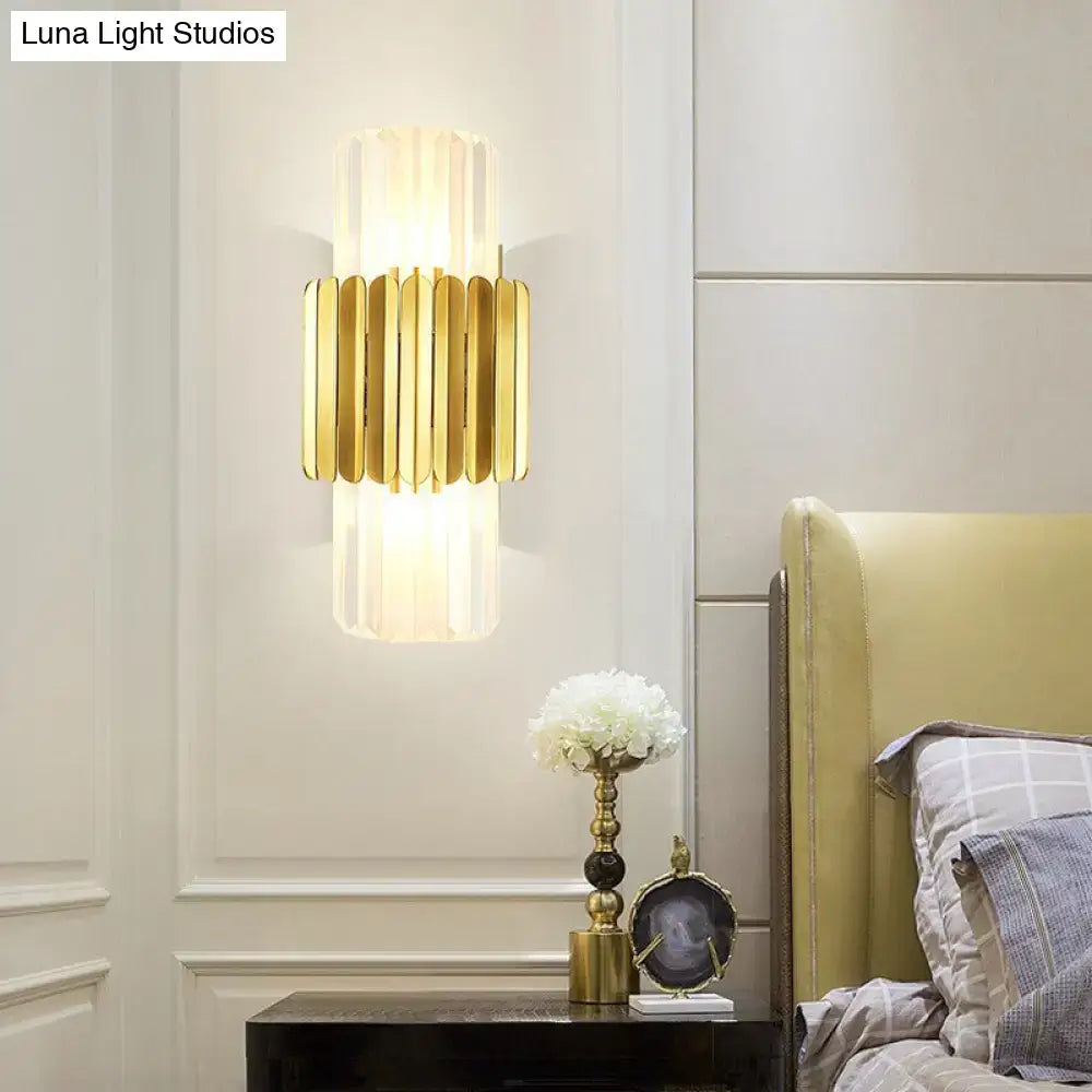 Gold crystal wall mount lamp with vertical gold rods and a white shade for luxe bedroom lighting on Tampa Home & Garden Store