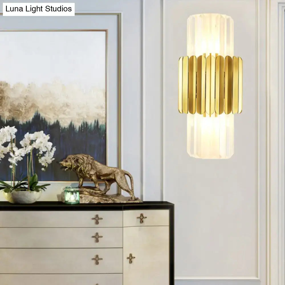 Gold crystal wall mount lamp by Decorbites with gold slats around frosted glass cylinder on Tampa Home & Garden Store