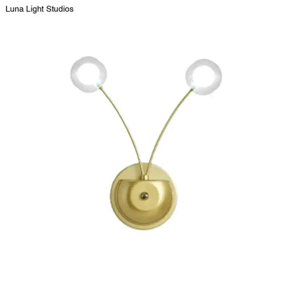Gold modern dual-arm wall lamp with two round glass globes and brass backplate Decorbites on Tampa Home & Garden Store