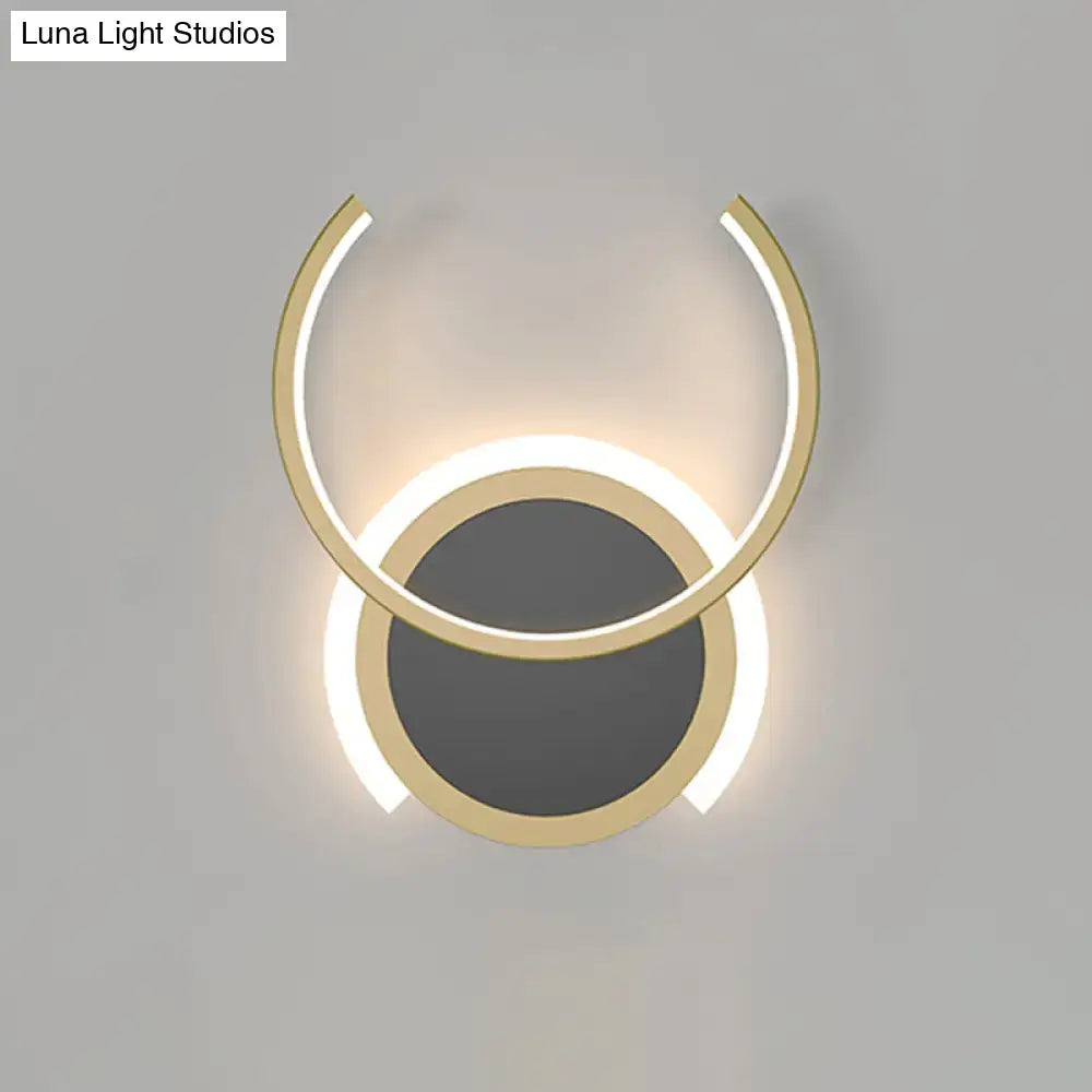 Gold Ring LED Wall Sconce by Decorbites with overlapping circular gold rings and warm backlight on Tampa Home & Garden Store
