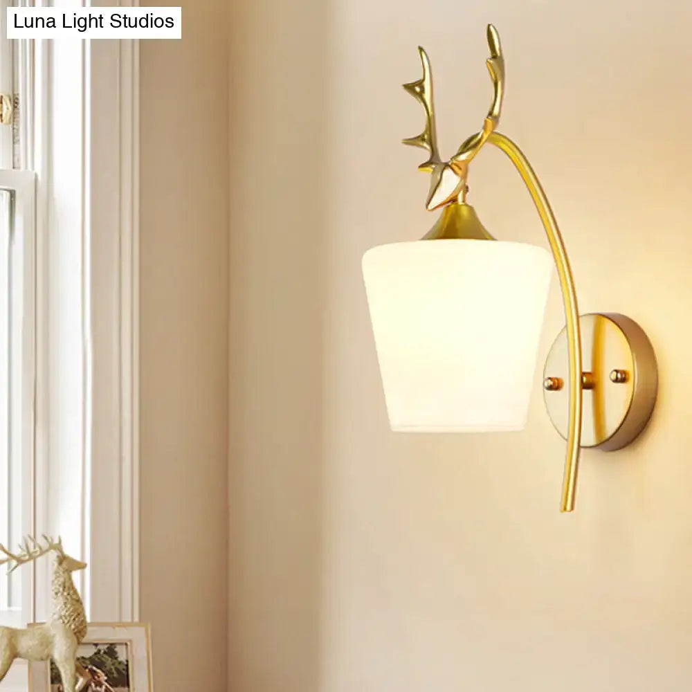 Gold Elk Wall Sconce by Decorbites with antler motif, brass finish, and white glass shade on Tampa Home & Garden Store