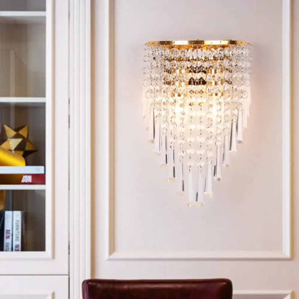 Gold crystal two-bulb wall sconce with cascading crystal strands on Tampa Home & Garden Store