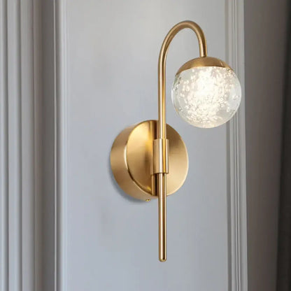 Gold Crystal Globe 2-Light Sconce in brass finish with bubbled glass globe and curved arm on Tampa Home & Garden Store