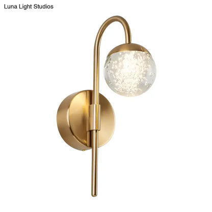 Gold brass globe sconce with seeded glass shade and curved arm, 1-light Decorbites on Tampa Home & Garden Store