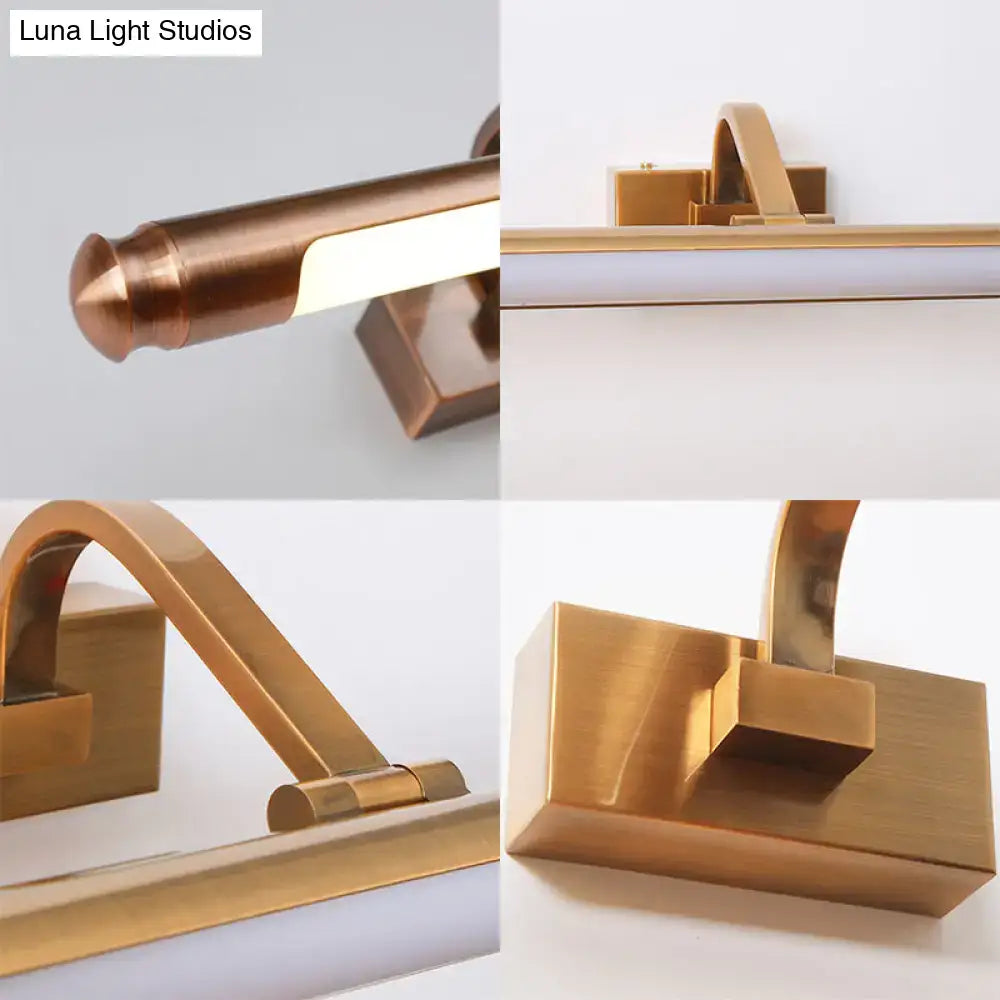 Gold tubed vanity light by Decorbites; modern brass metal fixture with square backplate on Tampa Home & Garden Store