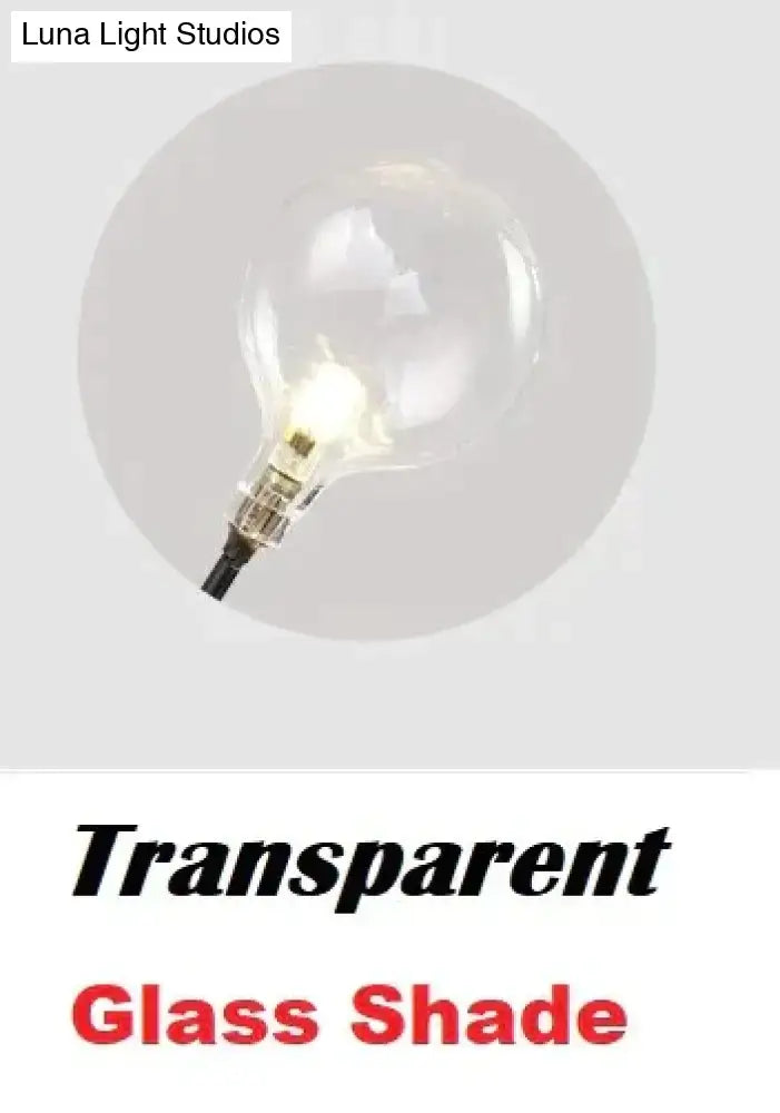 Wall light with transparent glass shade and clear bulb, Luna Light Studios on Tampa Home & Garden Store