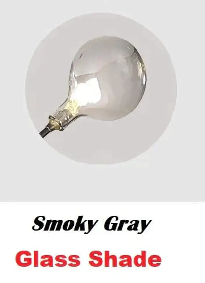 Wall light Decorbites with smoky gray glass shade and gold finish on Tampa Home & Garden Store