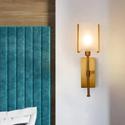 Modern gold frosted glass wall sconce with pencil arm by Decorbites on Tampa Home & Garden Store