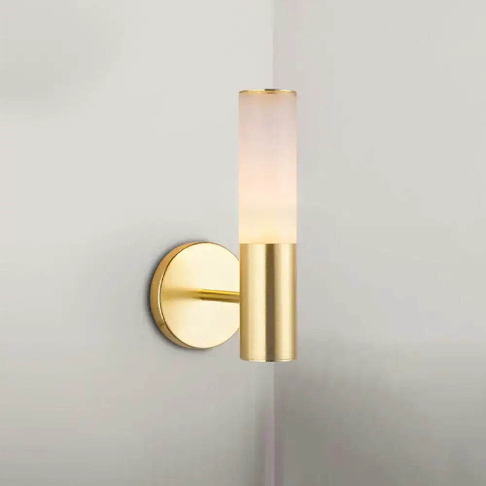 Gold frosted glass wall sconce by Decorbites with cylindrical shade and brass mount on Tampa Home & Garden Store