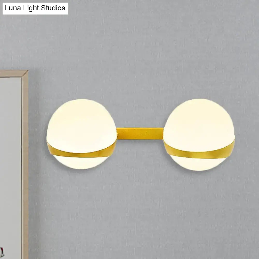 Gold frosted glass two-bulb wall sconce with brass tone bar by Decorbites on Tampa Home & Garden Store