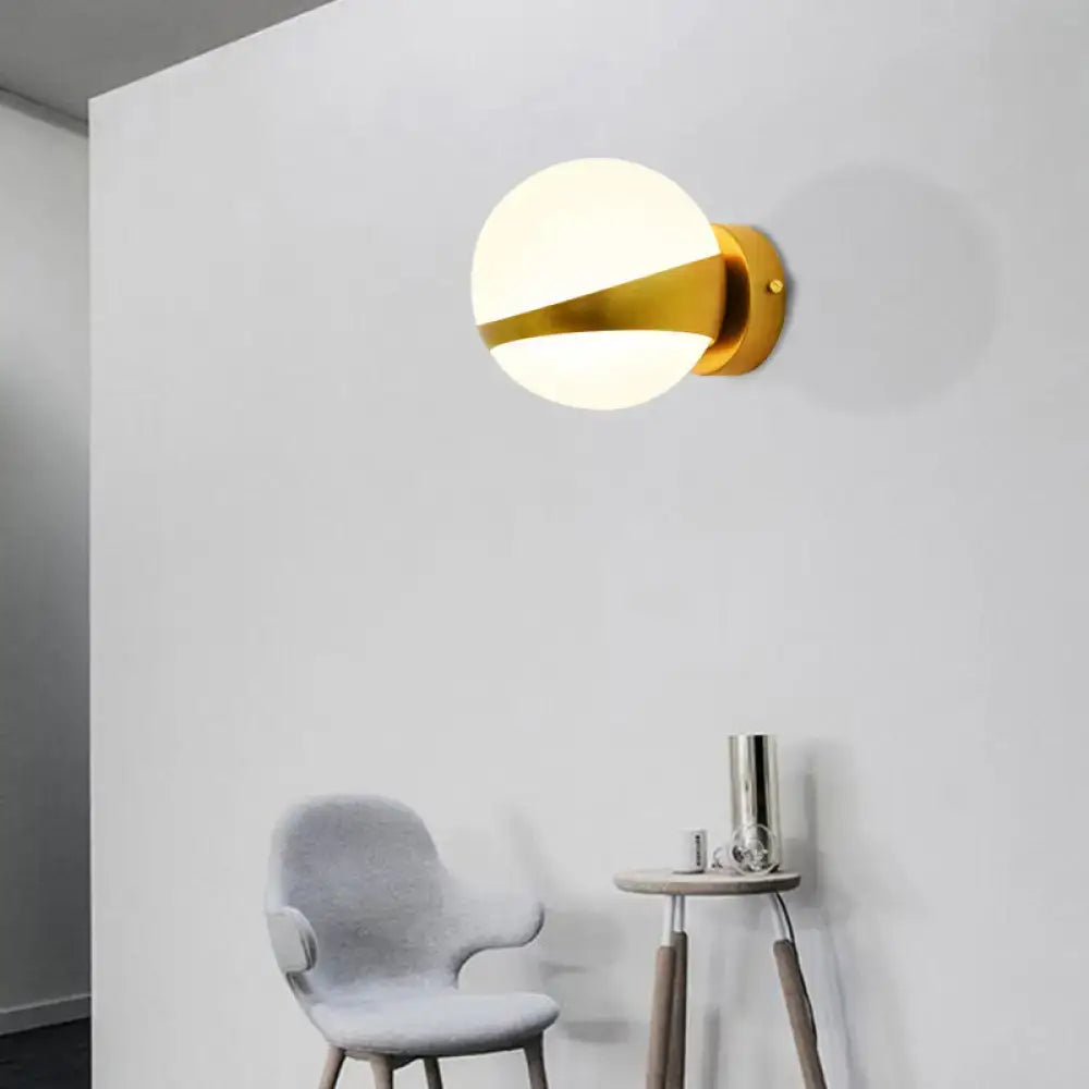 Gold frosted glass two-bulb sconce with brass mount by Decorbites on wall on Tampa Home & Garden Store