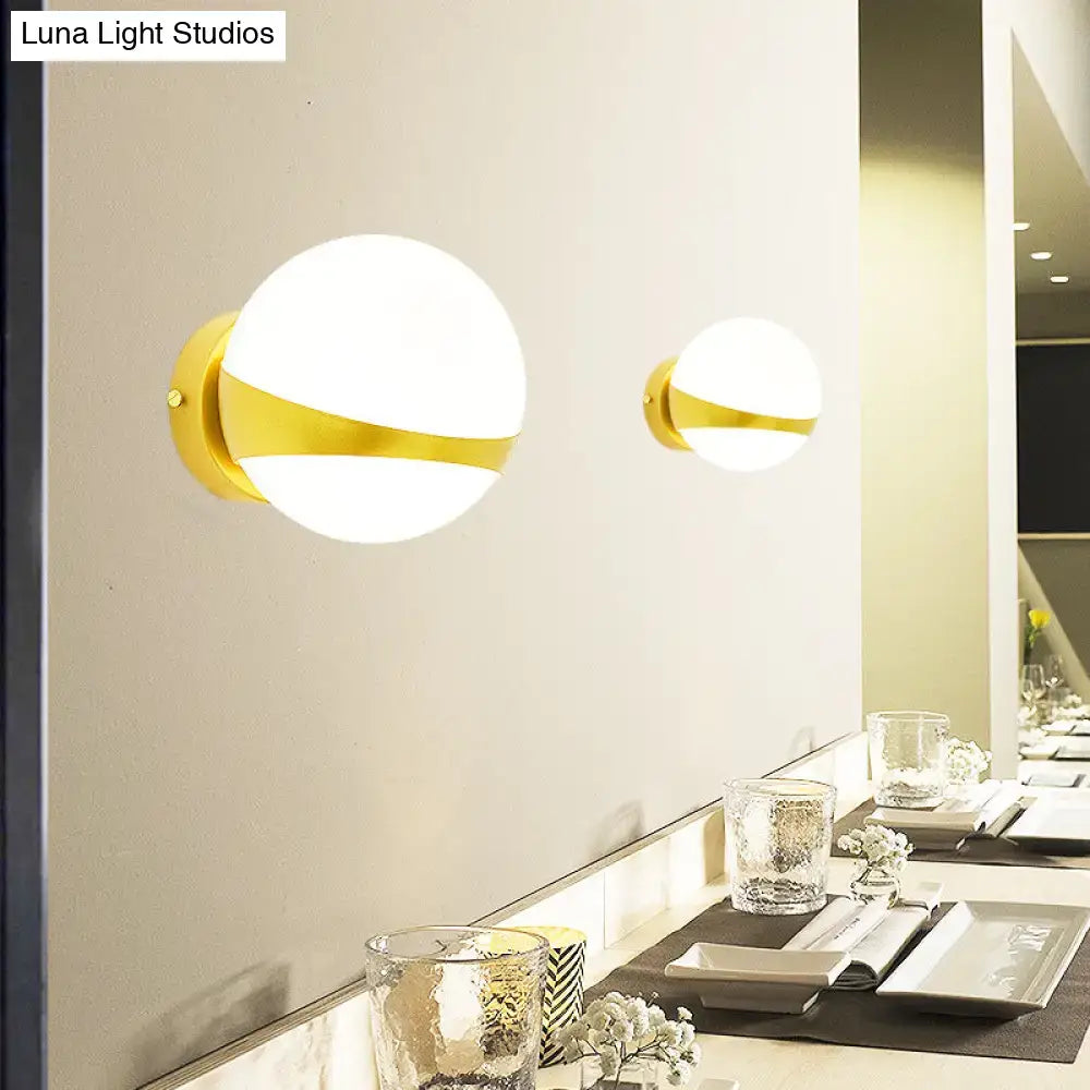 Gold frosted glass two-bulb wall sconce with brass band, pair on wall on Tampa Home & Garden Store