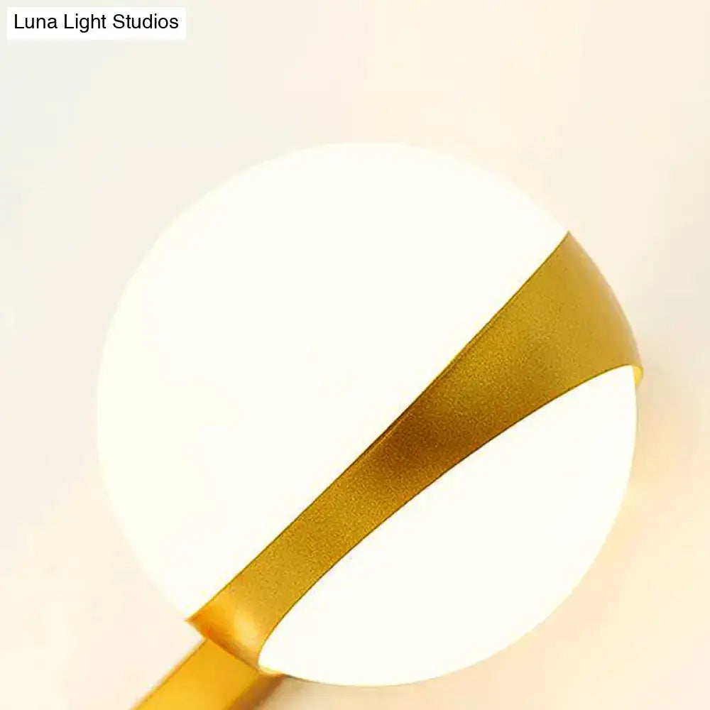 Gold frosted glass two-bulb sconce with gold metal band on Tampa Home & Garden Store