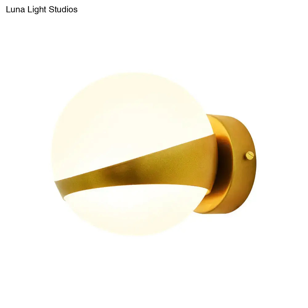 Gold frosted glass two-bulb wall sconce with brass band on Tampa Home & Garden Store