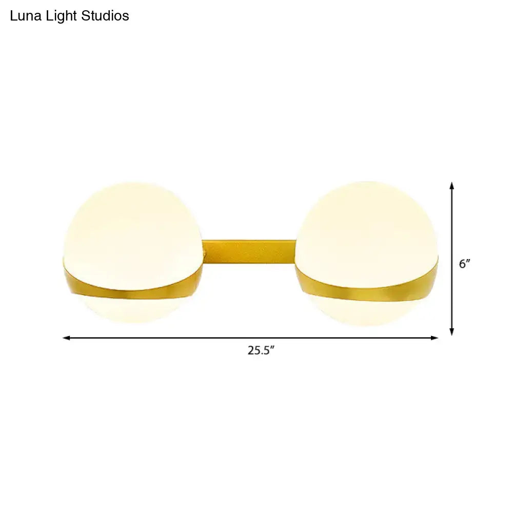 Decorbites gold frosted glass two-bulb sconce with brass-tone bar on Tampa Home & Garden Store