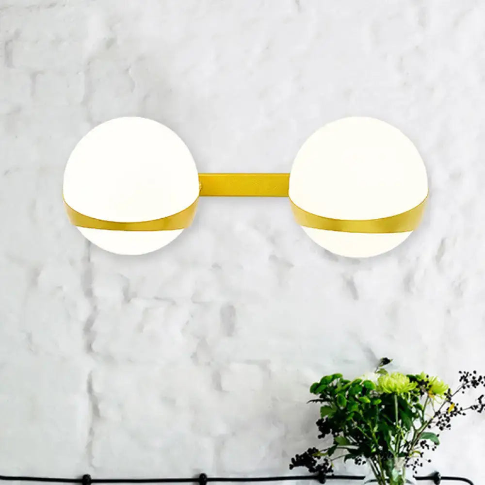 Gold frosted glass two-bulb sconce by Decorbites, wall-mount fixture with gold bar on Tampa Home & Garden Store