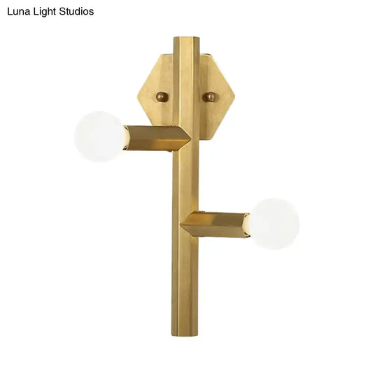 Gold vertical tube bedroom wall light with two horizontal arms and white globe bulbs on Tampa Home & Garden Store