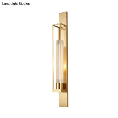 Gold ribbed wall lamp sconce with brass backplate and vertical glass tube bulb on Tampa Home & Garden Store