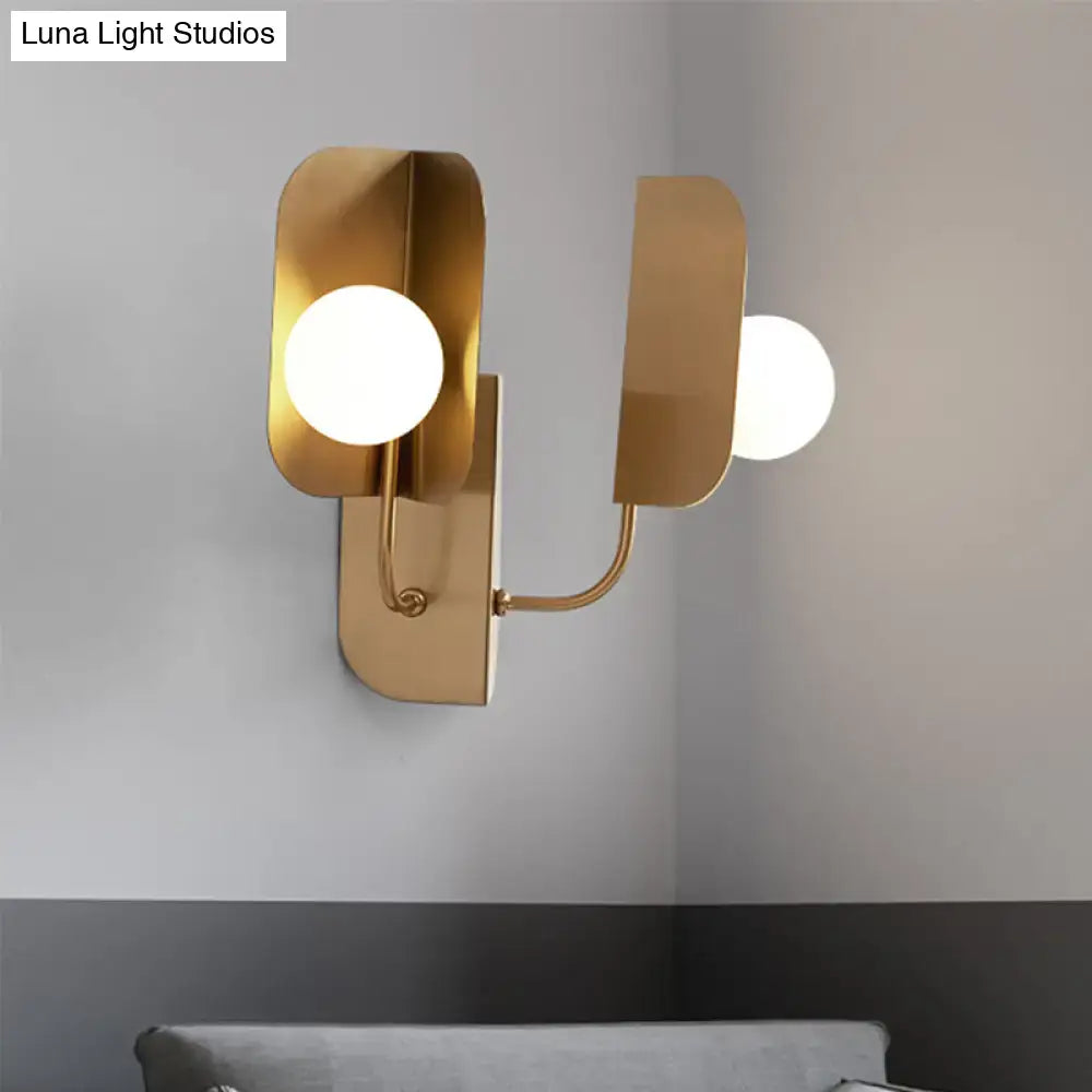 Gold Globe Wall Sconce by Decorbites; dual gold metal arms with white glass globes on Tampa Home & Garden Store