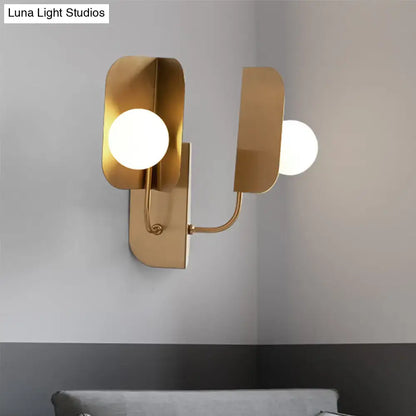 Gold Globe Wall Sconce by Decorbites; dual gold metal arms with white glass globes on Tampa Home & Garden Store
