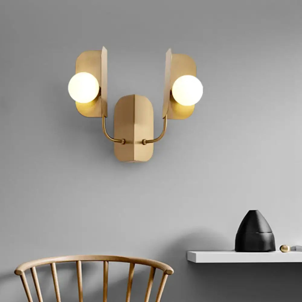 Gold globe wall sconce in brass finish with two white globe bulbs by Decorbites on Tampa Home & Garden Store