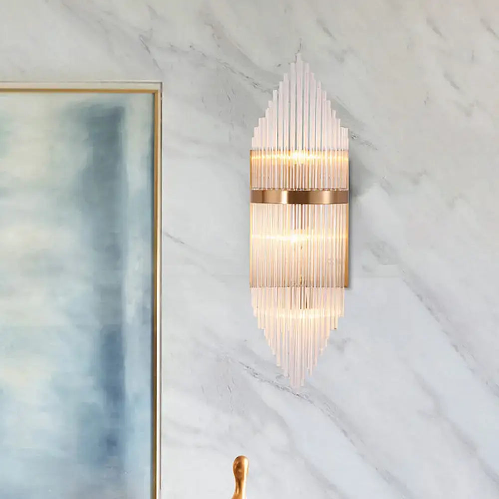 Gold fluted glass wall sconce by Decorbites with a gold band on marble wall on Tampa Home & Garden Store