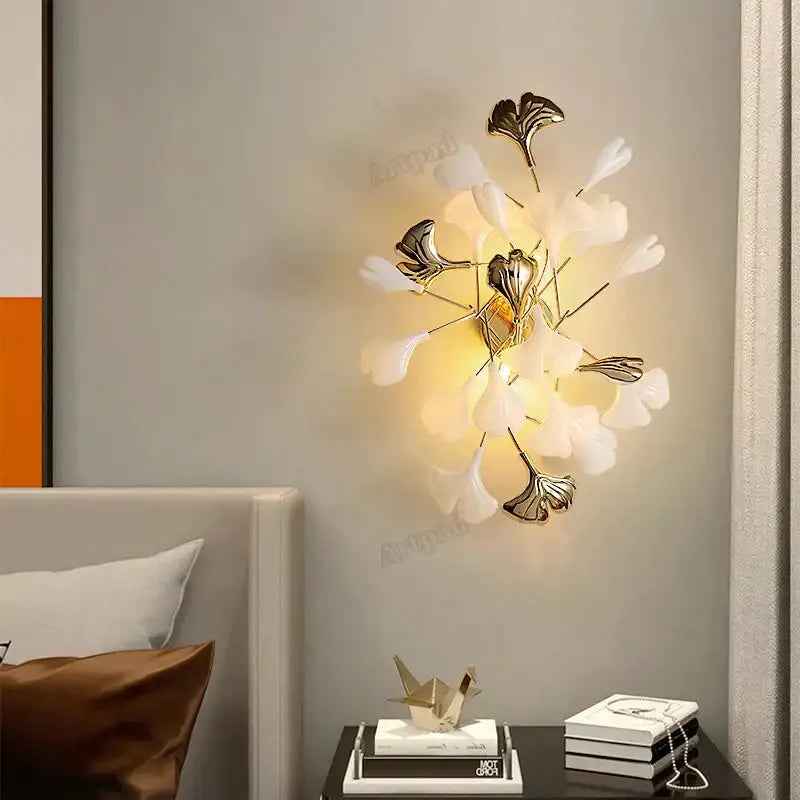 Gold Ginkgo Porcelain Wall Sconce by Decorbites with white leaf petals and warm glow on Tampa Home & Garden Store