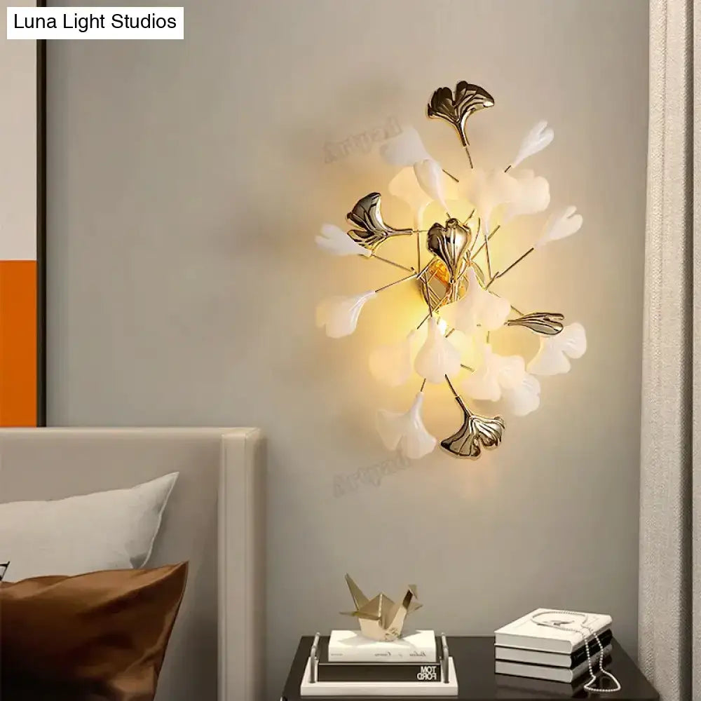 Decorbites Gold Ginkgo porcelain wall sconce with white leaves and brass stems on Tampa Home & Garden Store
