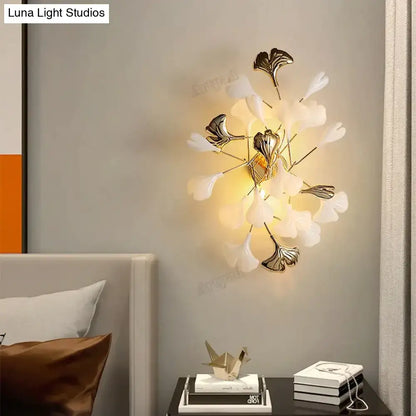 Decorbites Gold Ginkgo porcelain wall sconce with white leaves and brass stems on Tampa Home & Garden Store