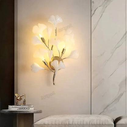 Gold Ginkgo Porcelain Sconce by Decorbites; wall sconce with white porcelain leaves, warm glow on Tampa Home & Garden Store