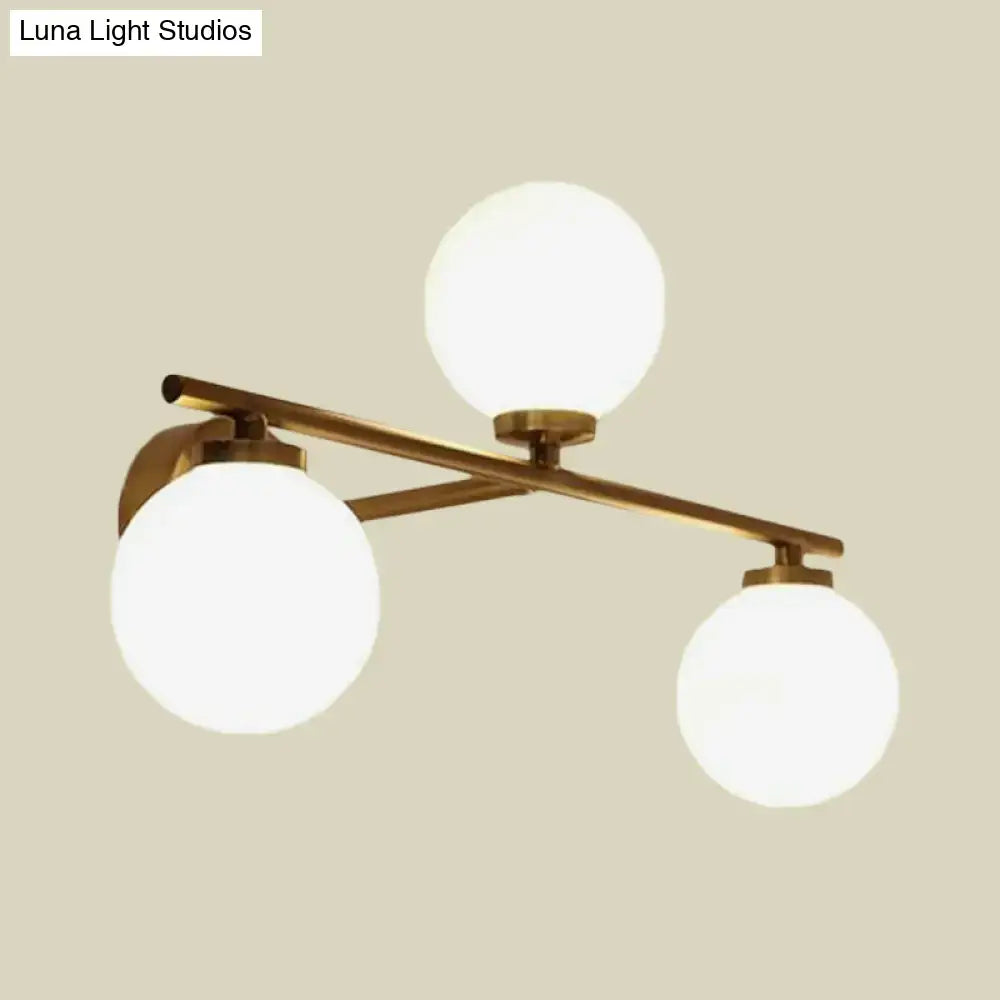 Gold opal glass hallway sconce with brass finish by Decorbites featuring three globe bulbs on Tampa Home & Garden Store