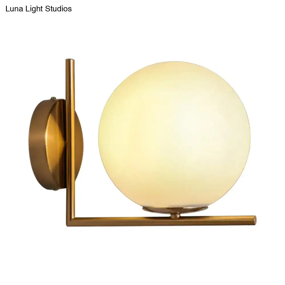 Gold Opal Glass Wall Light by Decorbites, brass wall sconce with spherical opal globe on Tampa Home & Garden Store